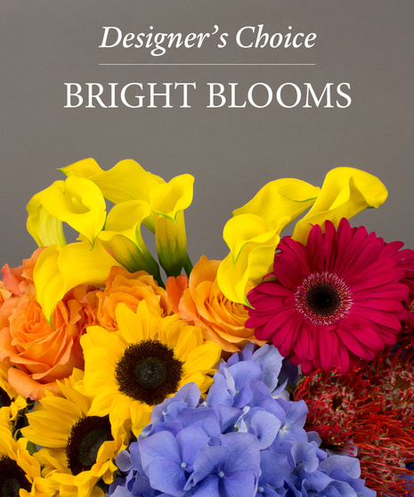 Image of a flower arrangement with yellow and purple flowers with text that reads: Designer's Choice.