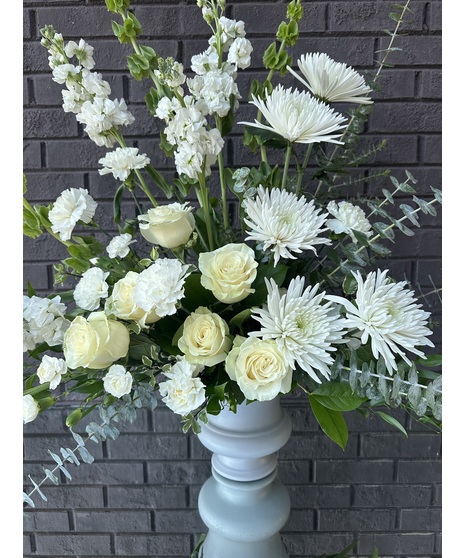 Silver jardinere vase of white roses, alstroemeria, carnations and more. 