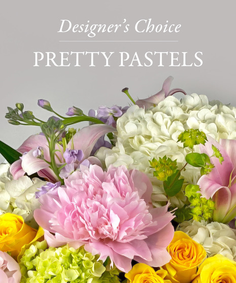 Image of a flower arrangement with yellow and purple flowers with text that reads: Designer's Choice.