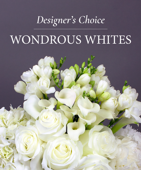 Image of a flower arrangement with yellow and purple flowers with text that reads: Designer's Choice.